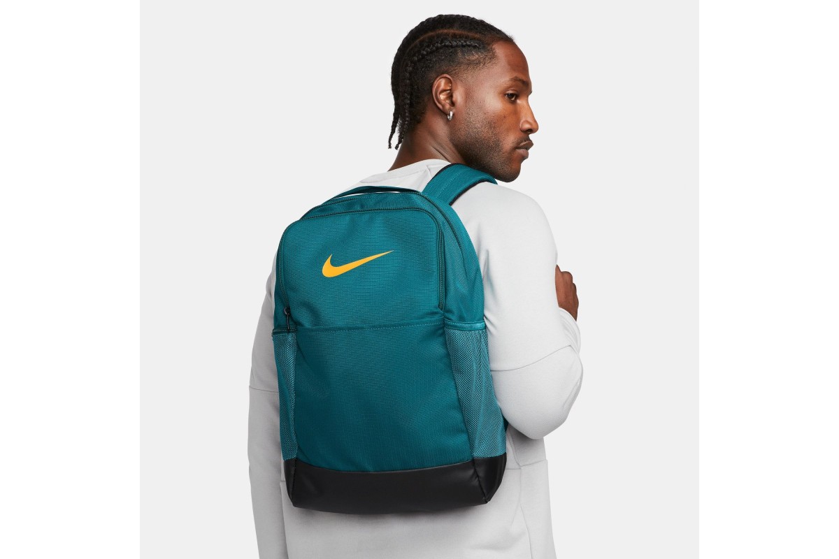 Nike Brasilia 9.5 Medium Backpack Geode Green Grab your gear and get going  with the Nike Brasilia Backpack. It has plenty of pockets to help you stay  organized including a sleeve to