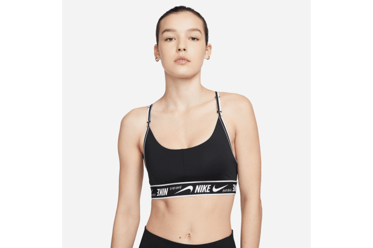 Nike Indy Light-Support Padded Logo Sports Bra Black / White Make simple  support even easier in a bra with straps that adjust in the front. Soft  fabric (made with at least 50%