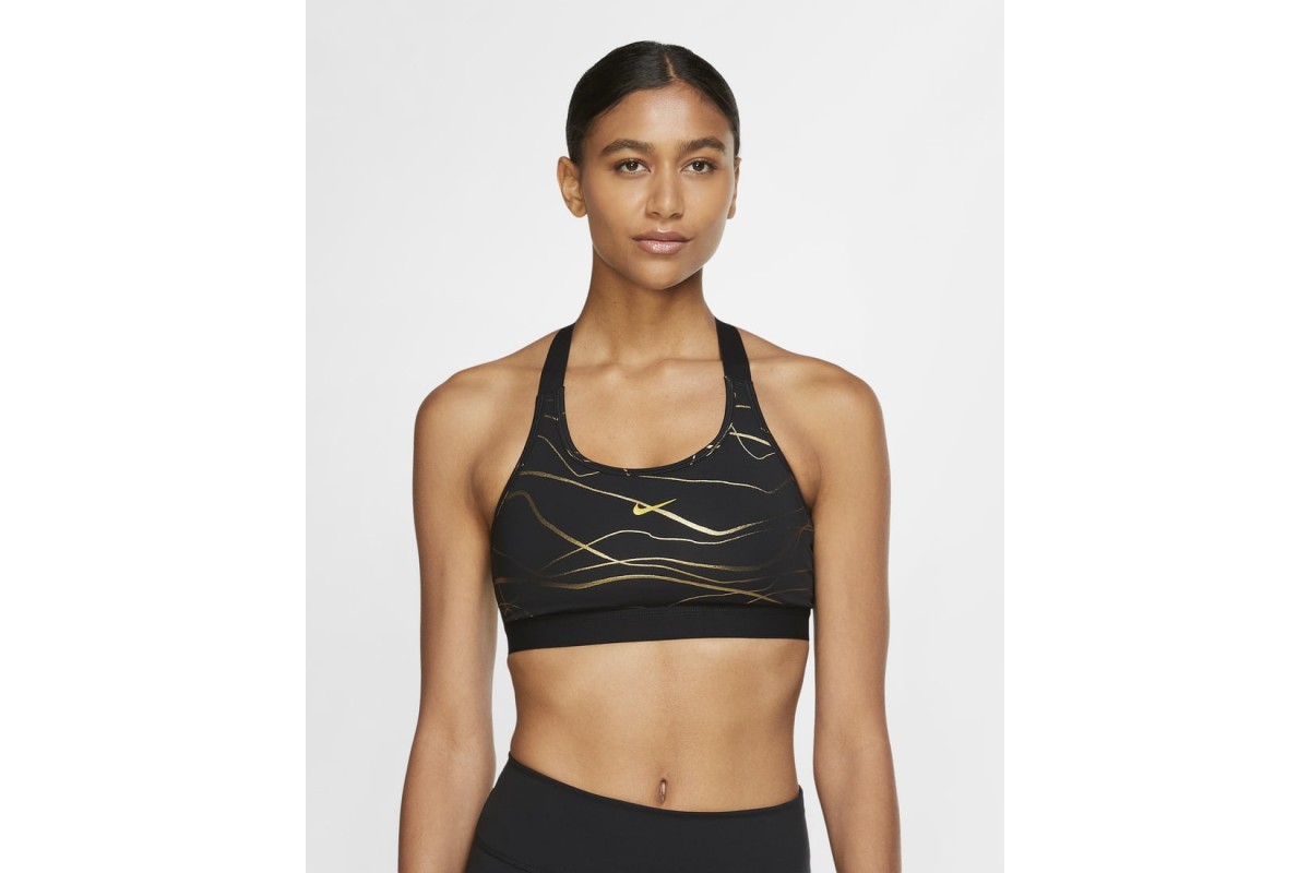 Nike Swoosh Icon Clash Sports Bra Black / Metallic Gold The Nike Swoosh  Icon Clash Sports Bra is inspired by Kintsugi, the Japanese art of  repairing ceramics with gold lacquer. The soft