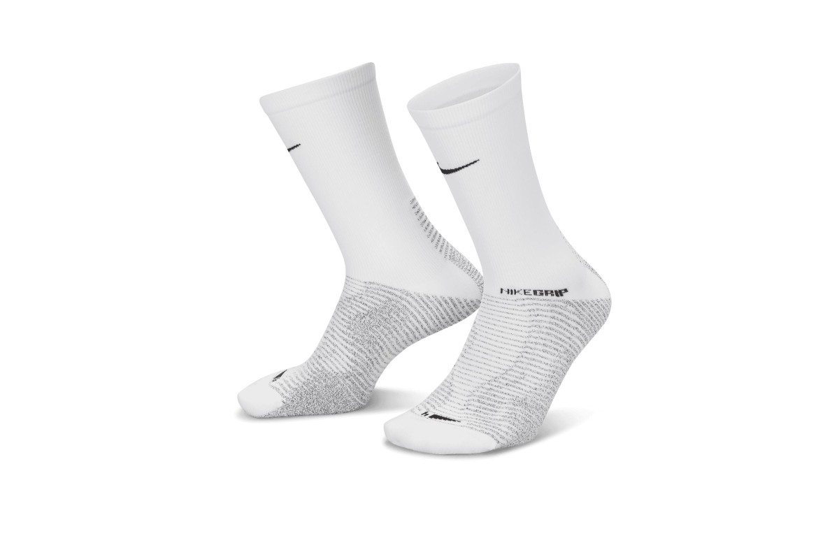 NikeGrip Strike Socks Play with confidence in the NikeGrip Strike Socks.  Sweat-wicking fabric and anti-slip yarns help keep your feet securely  placed